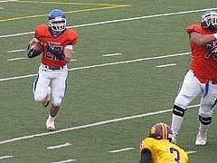 Son, Adam, as a running back carrying the ball for Division II school, University of Mary, Bismarck ND during fall 2013 season.